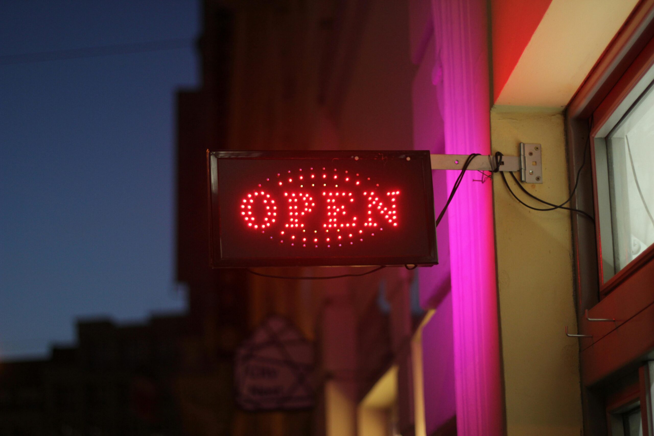 weatherproof illuminated LED shop sign on commercial building
